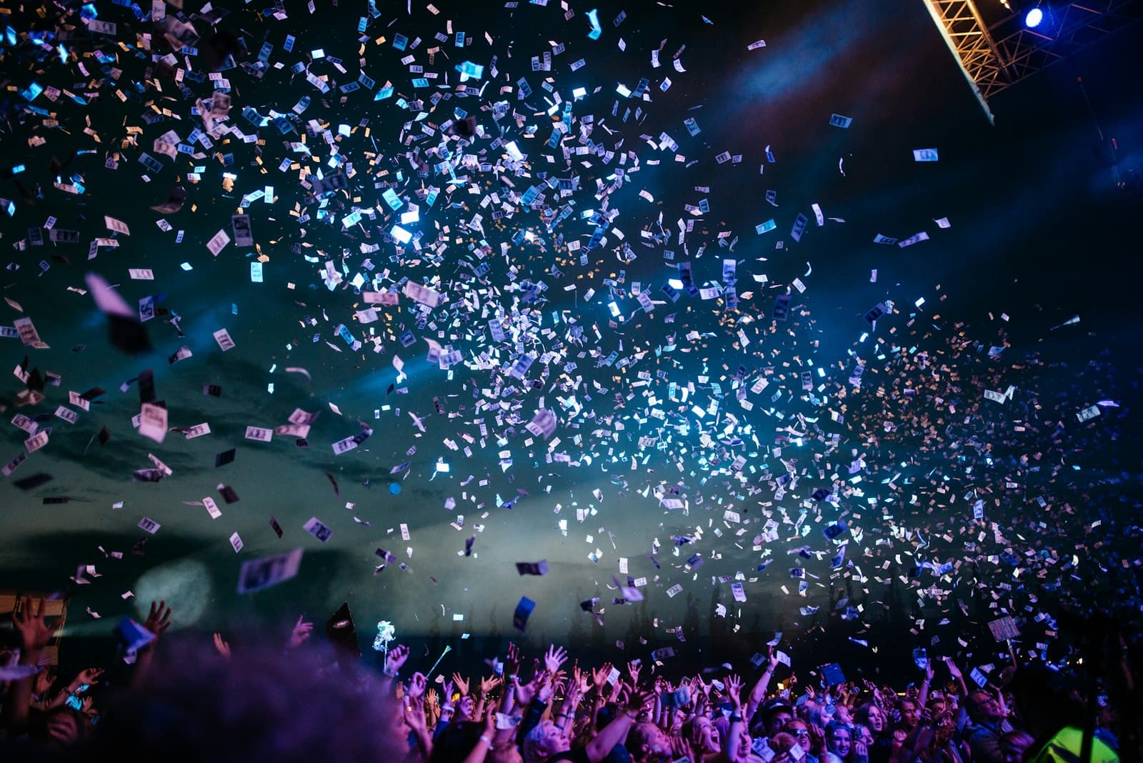 Confetti falling over a crowd at a live event